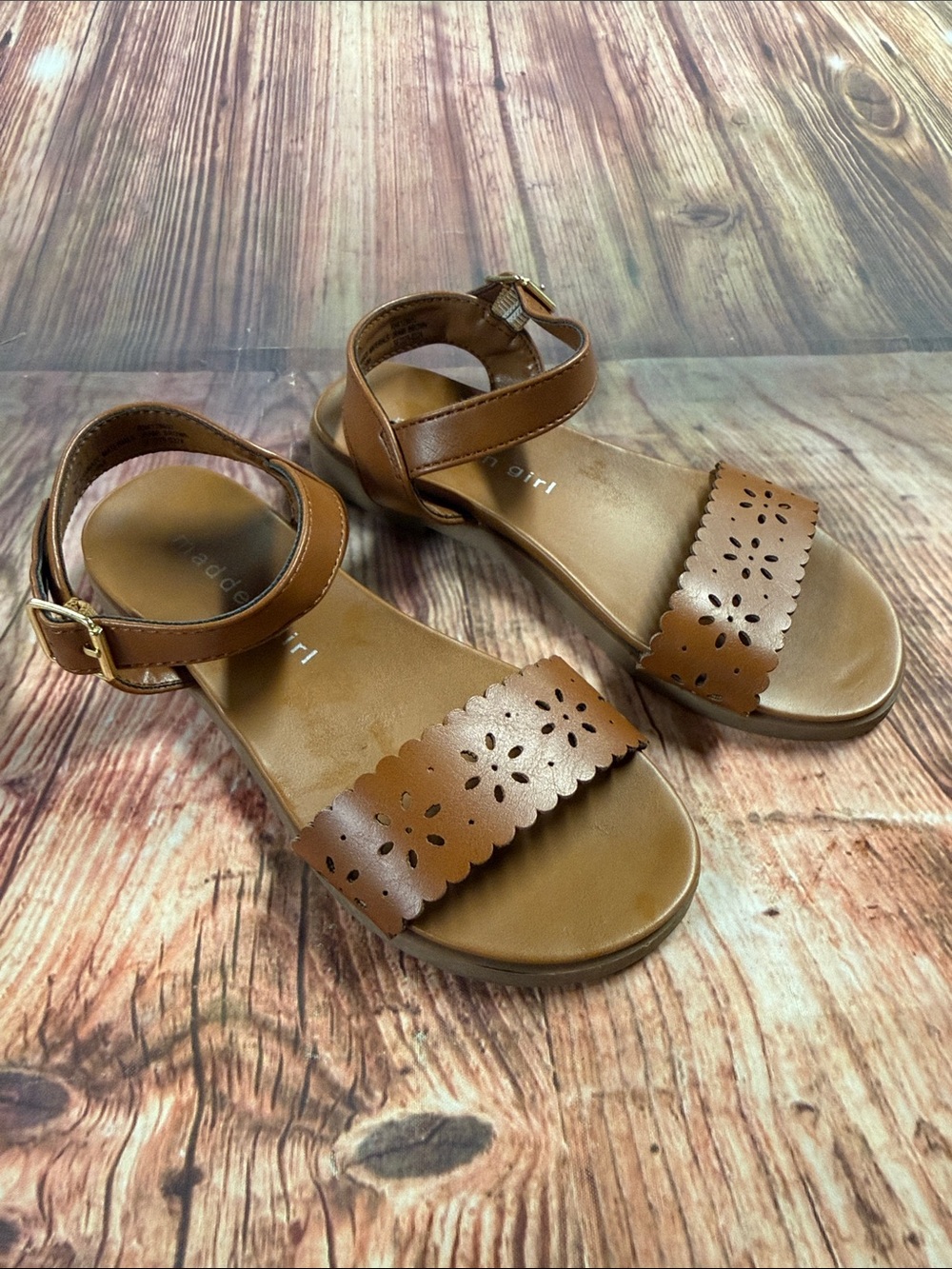 Brown Sandals with Floral Cutouts 
Brand Madden Girl